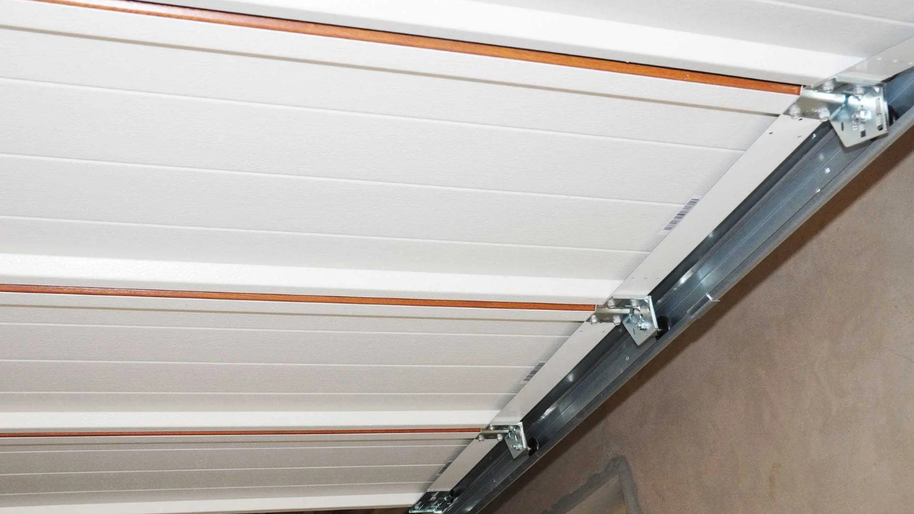 How to Use Nylon Garage Door Rollers for Track Damage Prevention